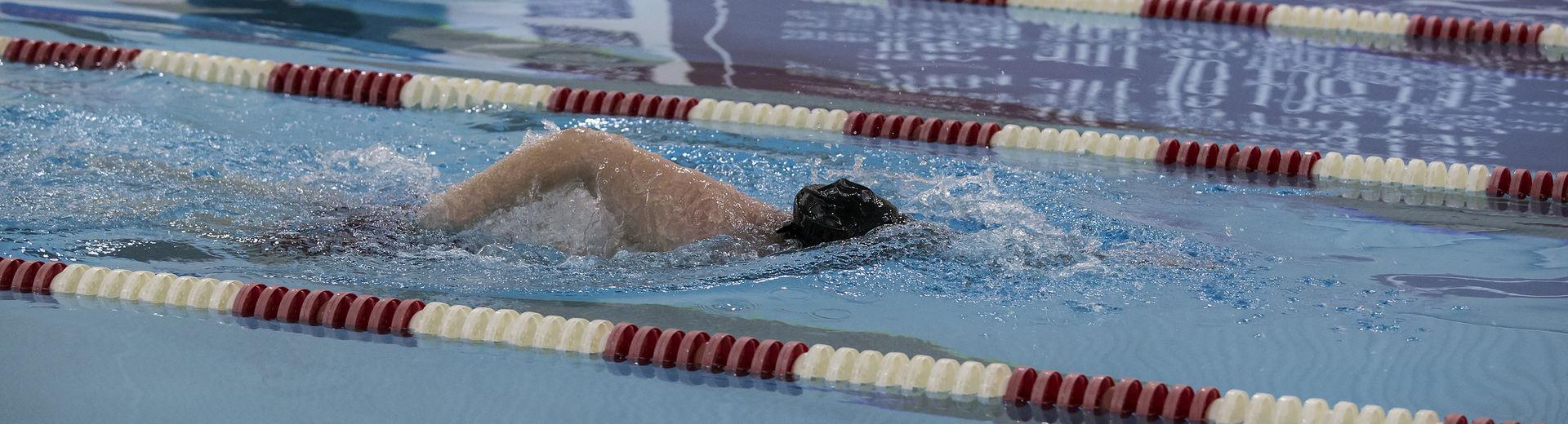 Male swimmer swimming laps